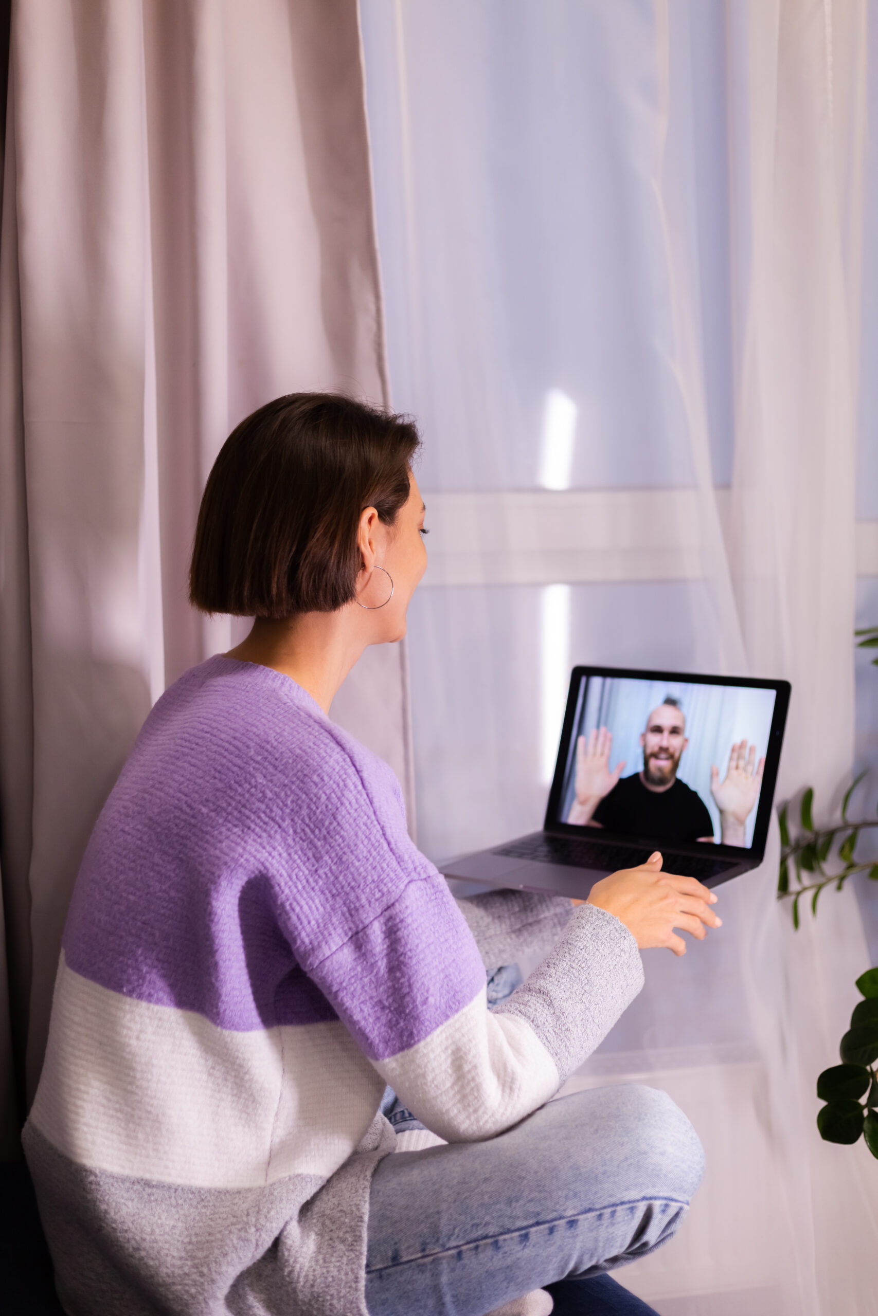 Woman at home face time video call her friends husband boyfriend, chatting online from laptop